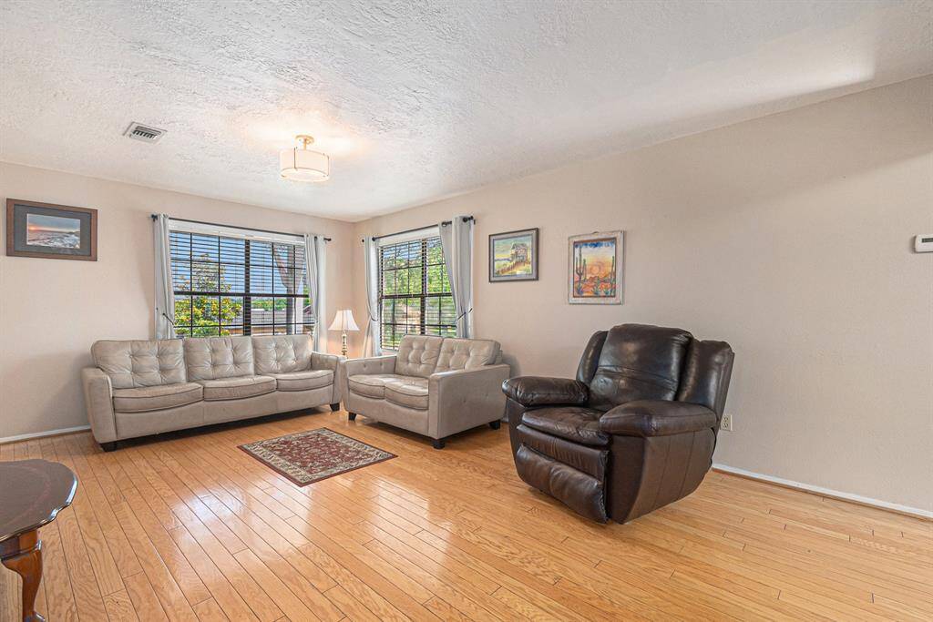 Living room with wood floors and natural light