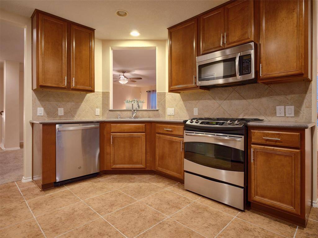 Stainless steel appliances and Corian countertops.