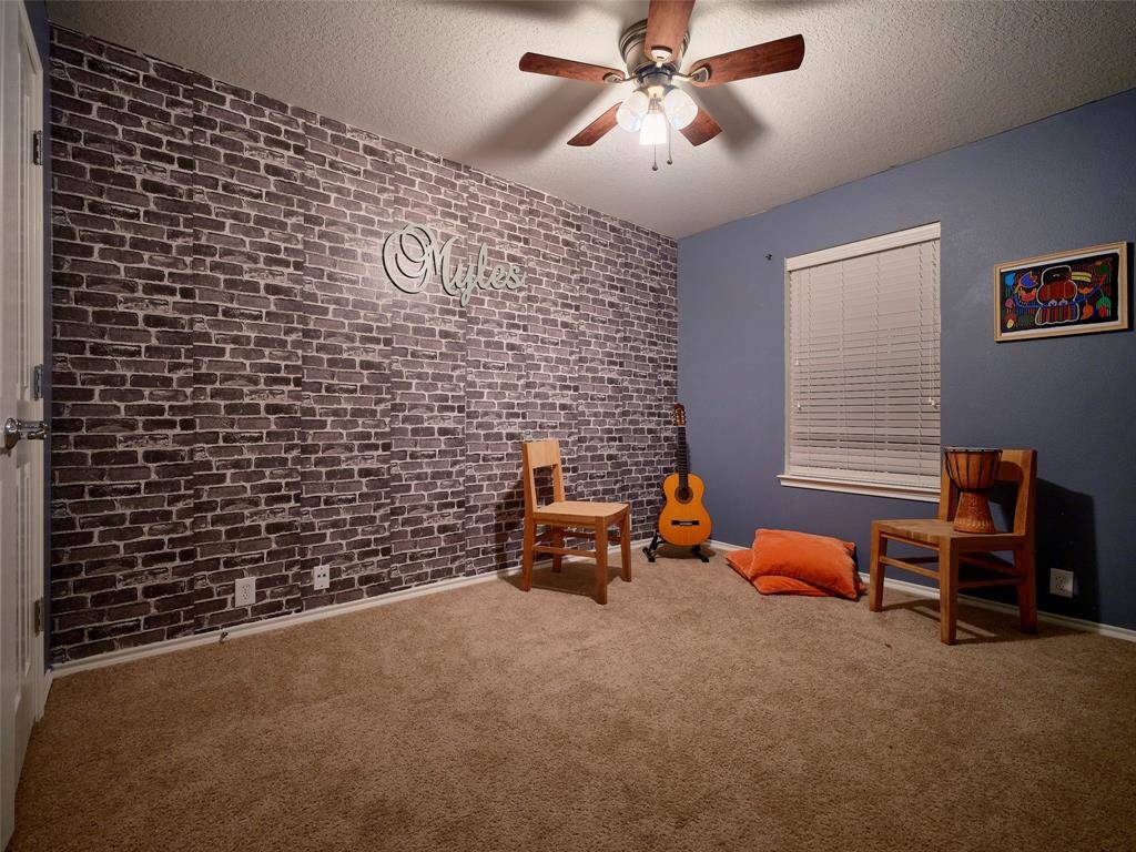Another spacious, secondary bedroom.