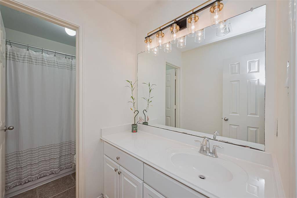 Third full bathroom with tub/shower combo next to Bedroom #5.