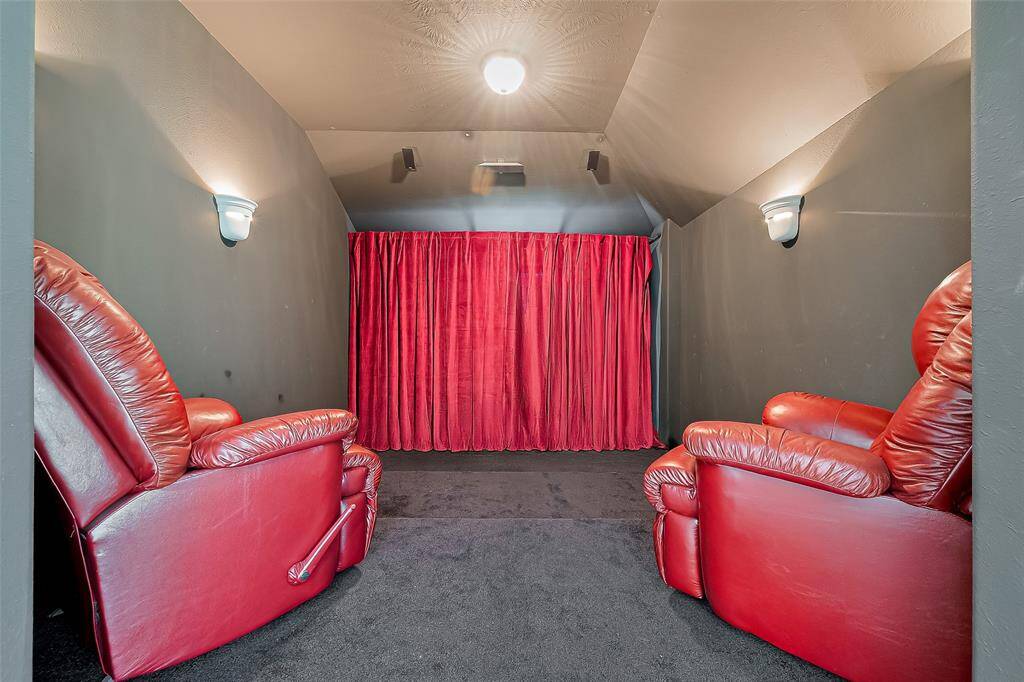 Media room/movie theater***Red curtain has been photoshopped to be full length. Actual curtain stops about 1-2 feet from the floor.