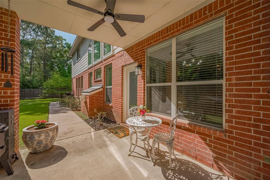 Covered patio with fan is perfect for entertaining.