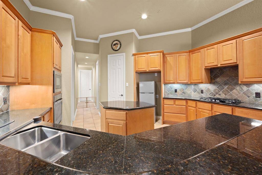 Full size Frig will be put in when Lease Signed.  Kitchen has granite counters, undermounted sink and under cabinet lighting with Gas Stove top
