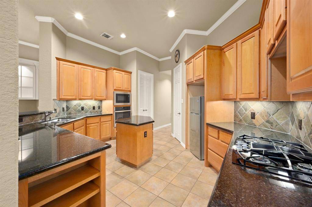 This Kitchen counter space is sure to please the chef of the family!  Frig replaced with signed Lease.