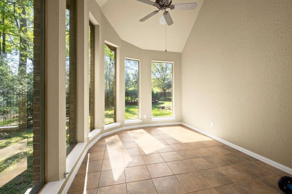 Sunroom has beautiful backyard views.  Relax with your favorite cup of libation!