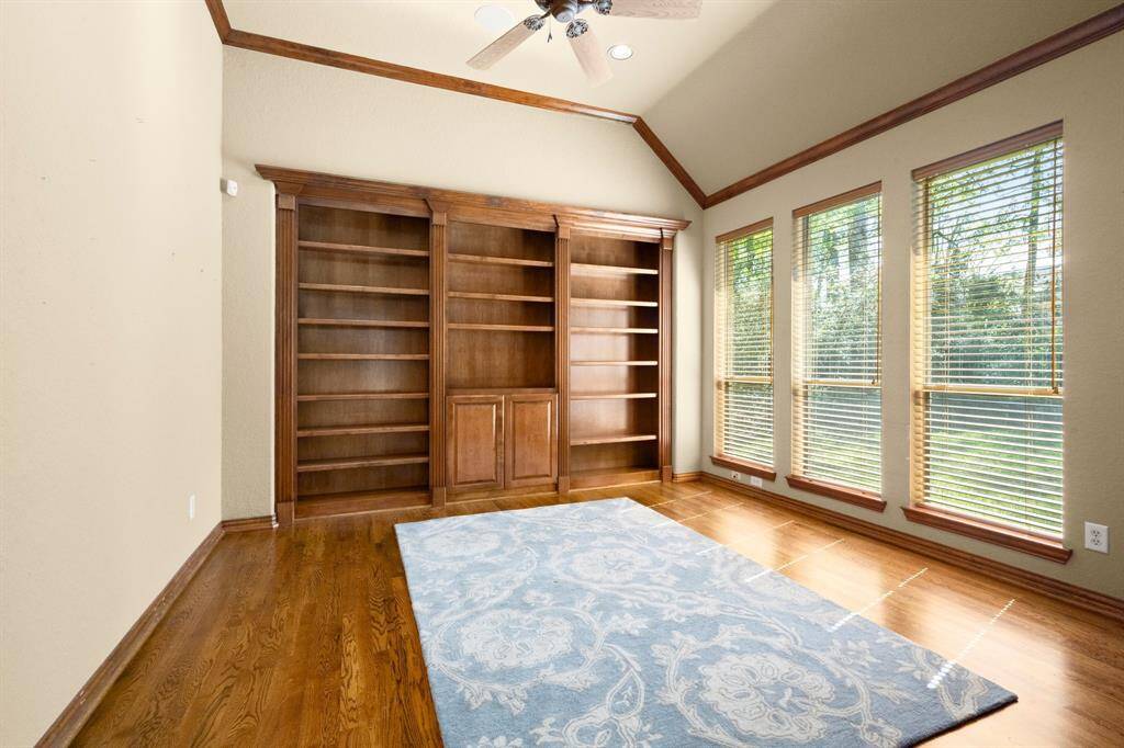 Home office with built-in shelving and French Doors for privacy