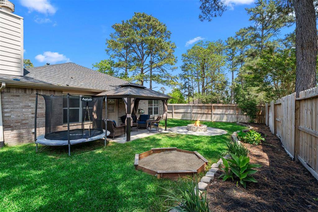 Backyard showing kids sandbox or future gardening box.