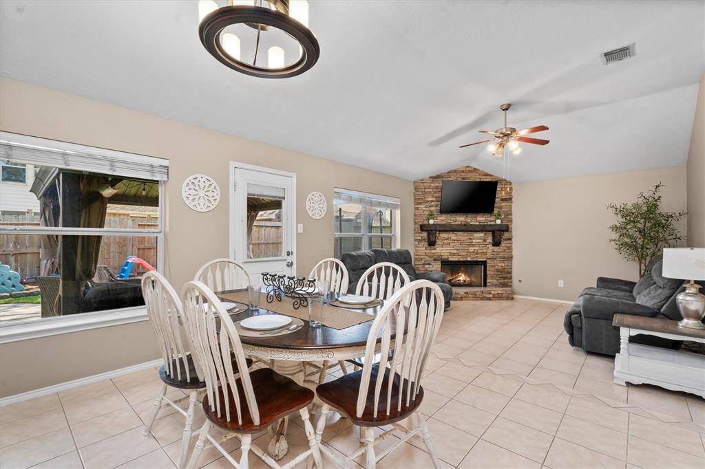 Main Living/Dining Area with upgraded Stacked Stone Fireplace w/ mantel and TV mount!
