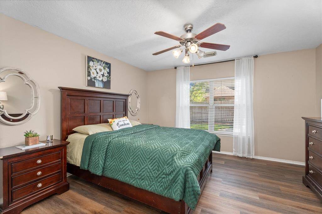 Large Master Suite with updated wood laminate floors.