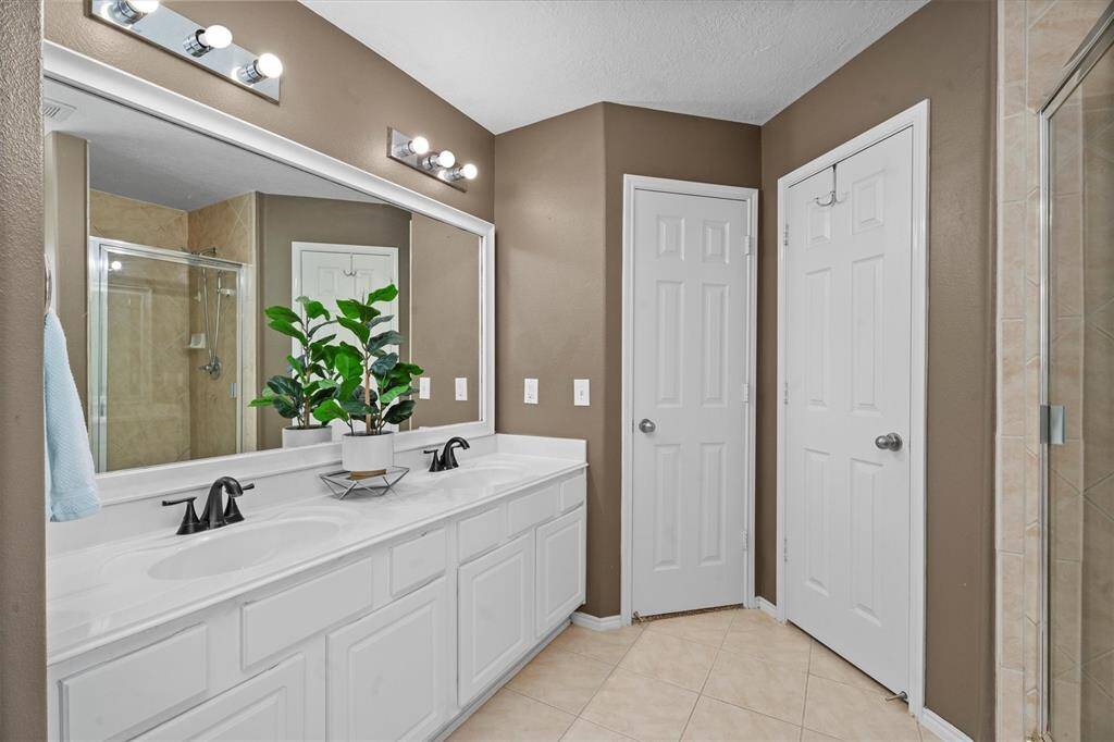 Master Bath includes a large walk-in closet, tiled shower and garden jetted tub.