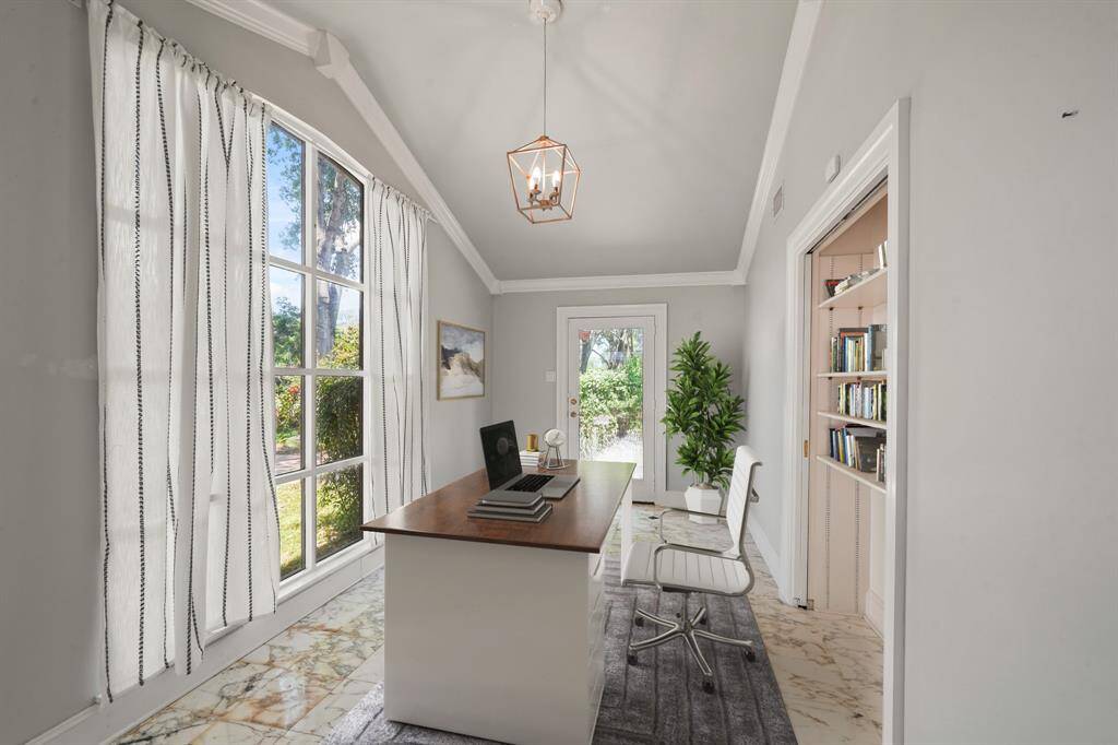 Virtually Staged:No need to leave your room to get your work done. This beautiful home office features crown molding, built-in units, and a large window that provides plenty of light throughout the day.