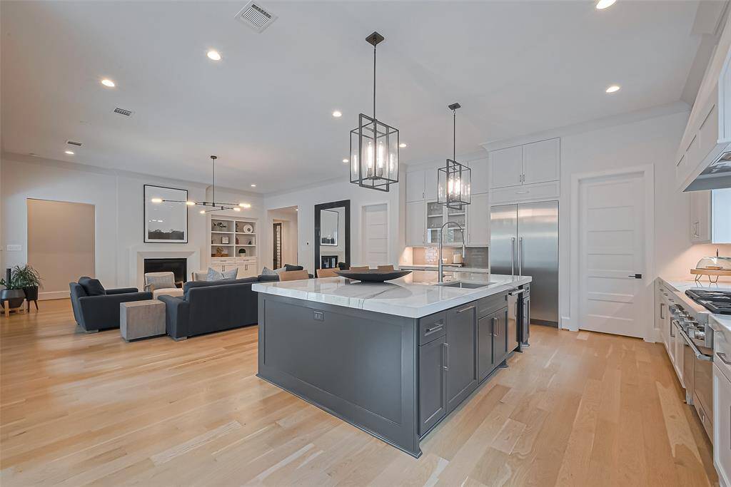 Another perspective of the kitchen reveals its seamless openness to the family room.