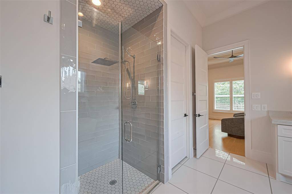 The primary bathroom includes an shower enclosure and a relaxing soaking tub.