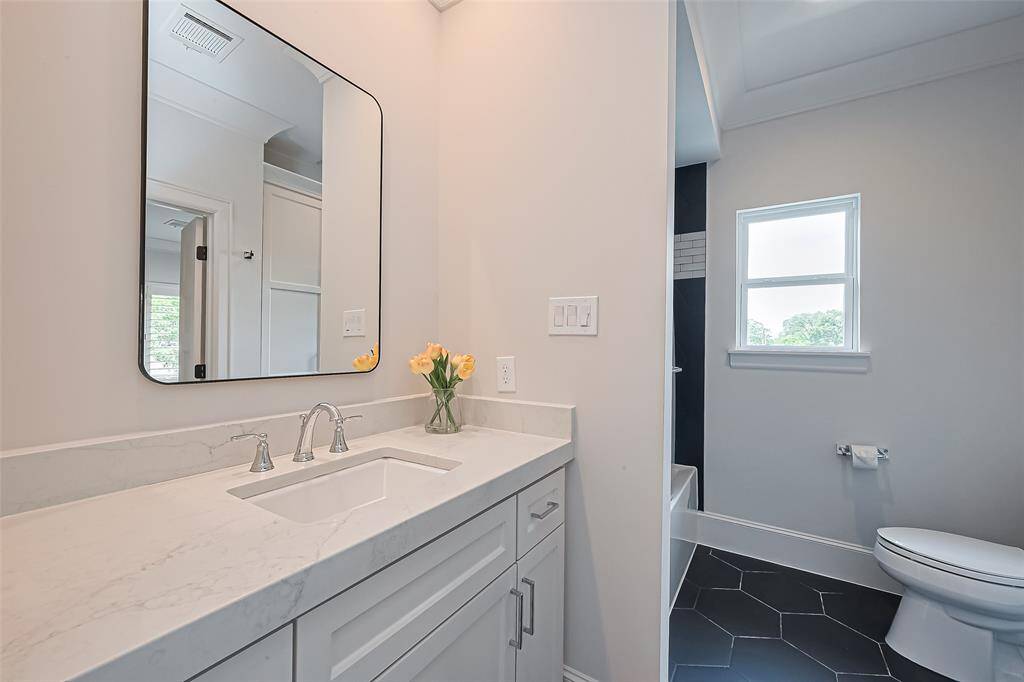 Ensuite bathroom for the third bedroom. Solid Surface countertops.