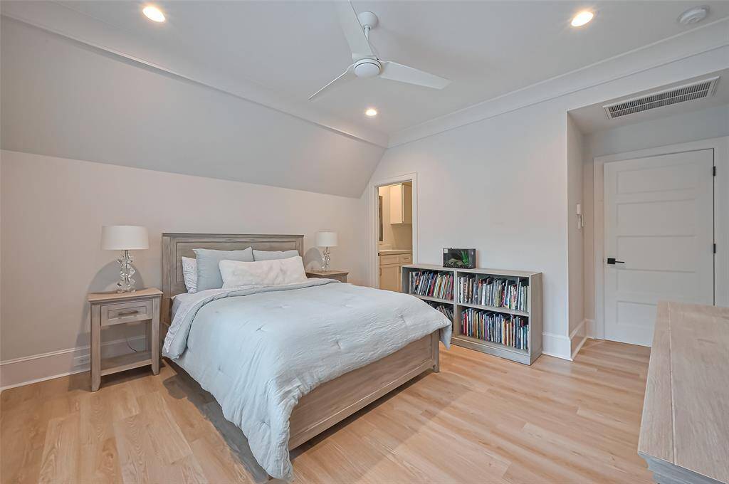 The fifth bedroom, located upstairs, includes a walk-in closet and an ensuite bathroom.