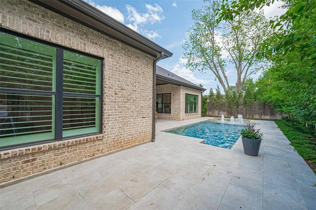 The extensive trees surrounding the home, provides a sense of privacy in the backyard.