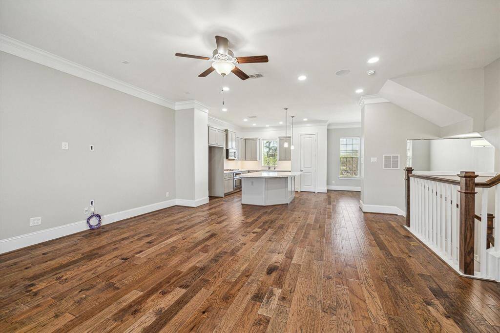 This spacious family room offers ample space for large cushy furnishings so everyone can gather here and relax comfortably.