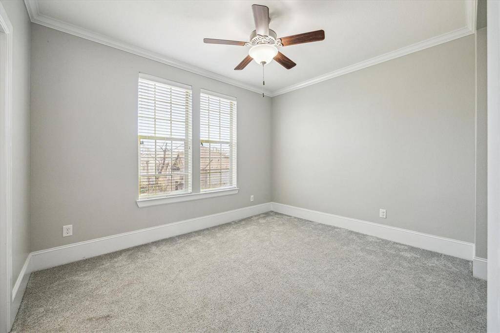 With two roomy guest suites, you'll always have room for company. This guest room offers warm neutral finishes including plush carpet and neutral paint, a lit fan, large closet and ensuite access to a full bathroom.