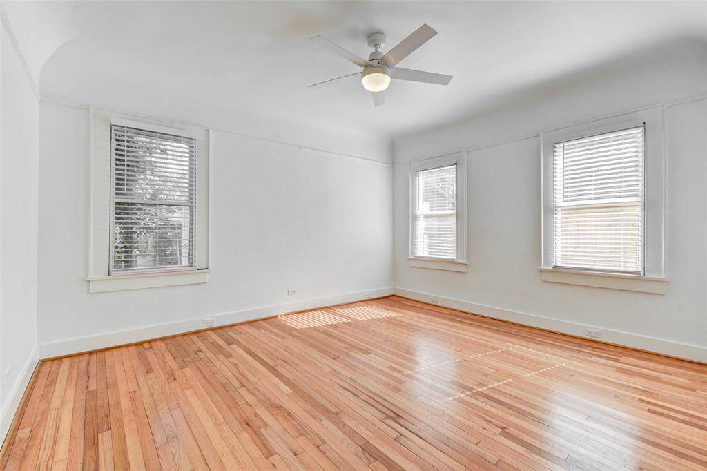 Bedroom overlooks backyard. Bedroom has a large storage closet, new ceiling fan and new blinds.