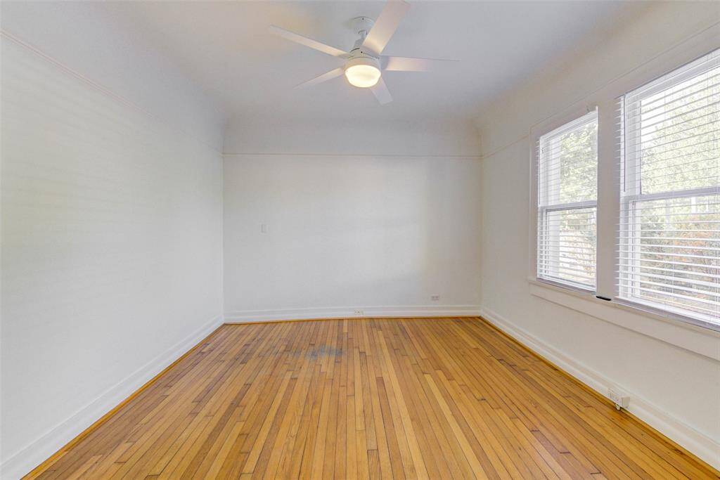 Original hardwoods throughout apt. Living room/dining room has lots of light, new blinds and a new ceiling fan.