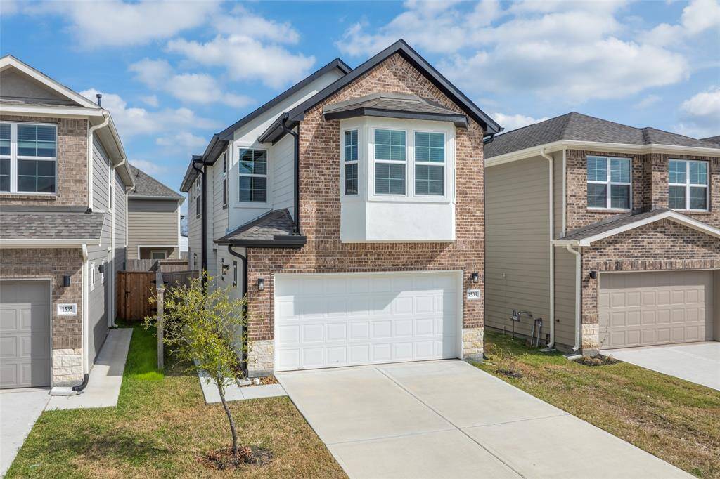 Curb appeal + covered entry.