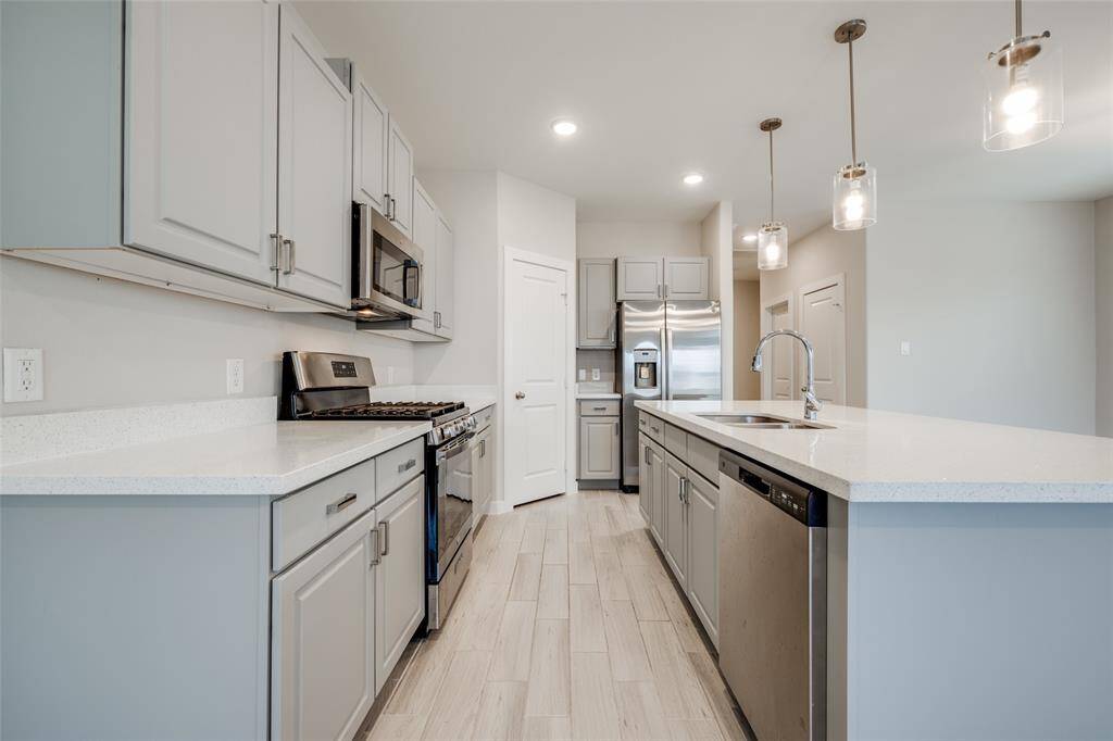 Kitchen with brushed nickel hardware adds a sleek finish.
