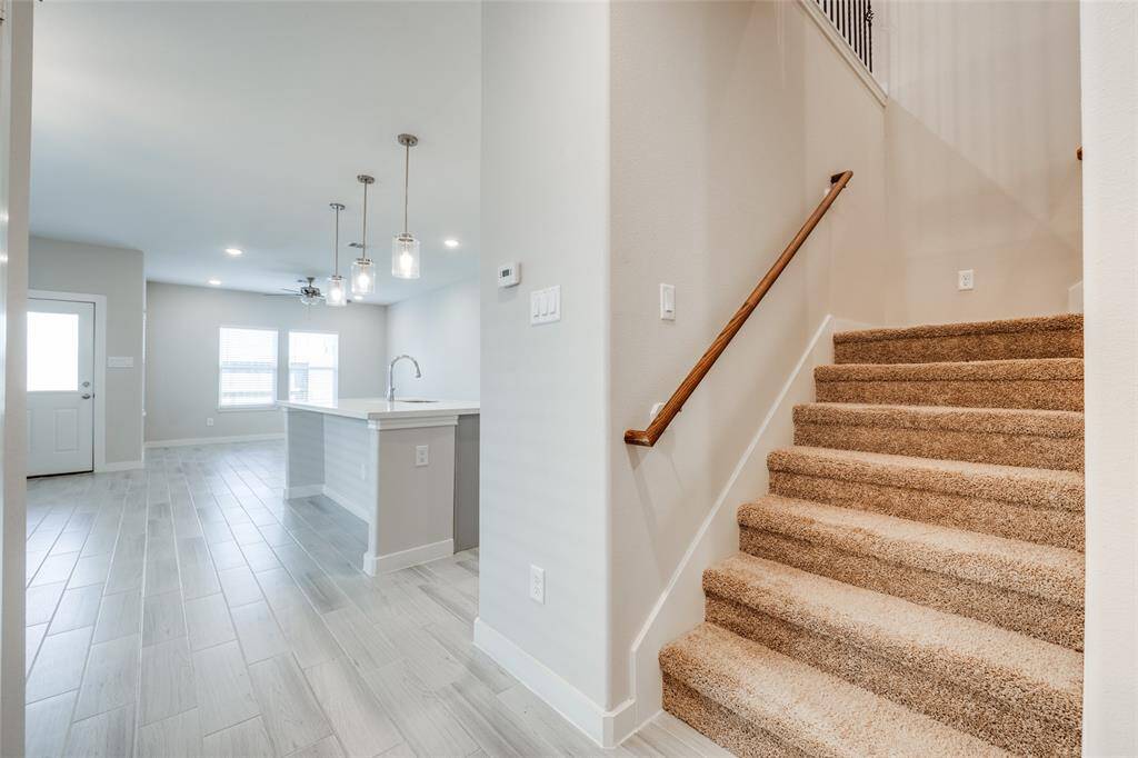 Fresh, like-new interiors lead to the upstairs bedrooms and bonus spaces.