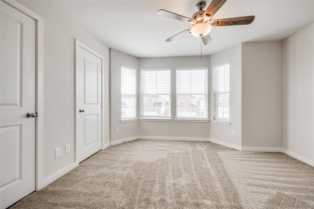 Secondary bedroom with bay windows and great natural light.