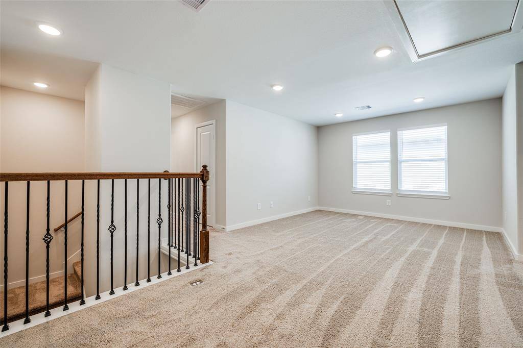 Clean, open upstairs living space with lots of natural light.