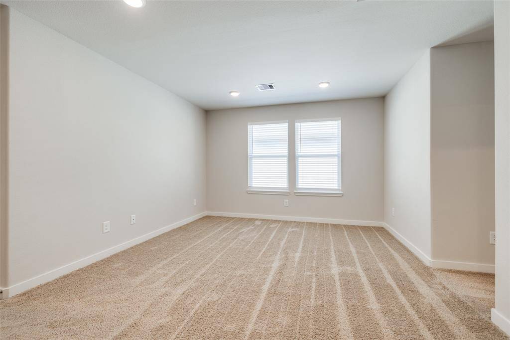 Bright upstairs space with a clean look, plenty of natural light, and a flexible layout.
