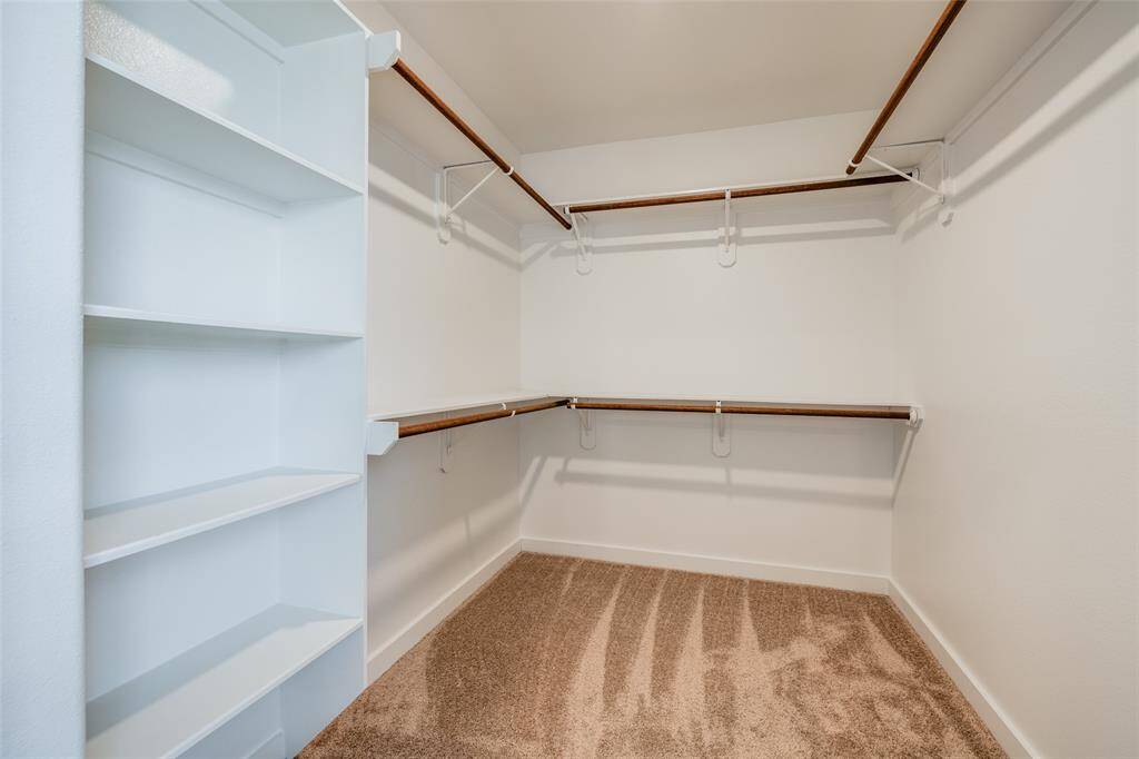 Walk-in closet off the primary suite—roomy enough for all your wardrobe favorites and then some.