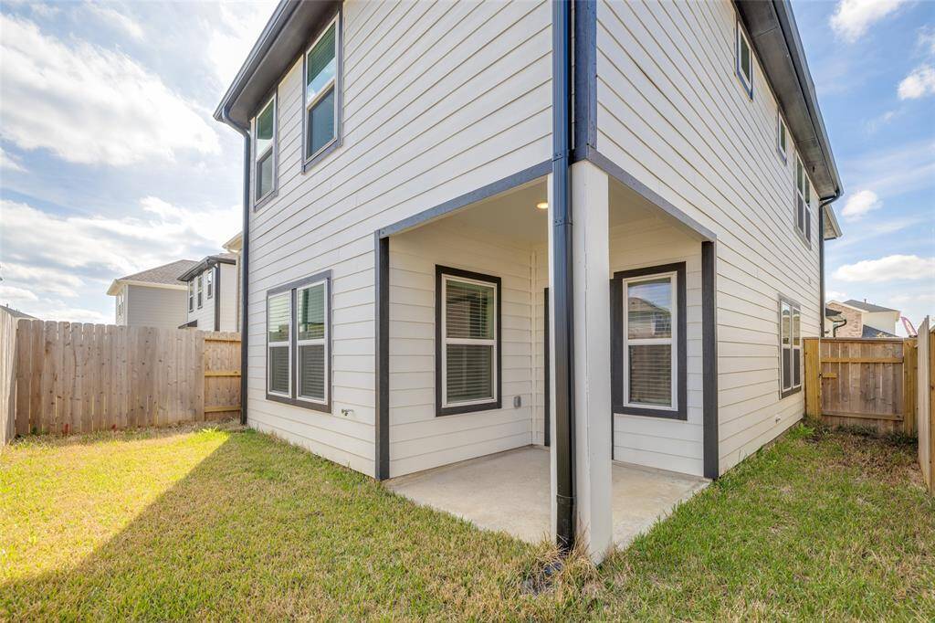 The wraparound fenced yard offers a versatile outdoor space—with plenty of room to relax, entertain, or just catch a quiet moment outside.