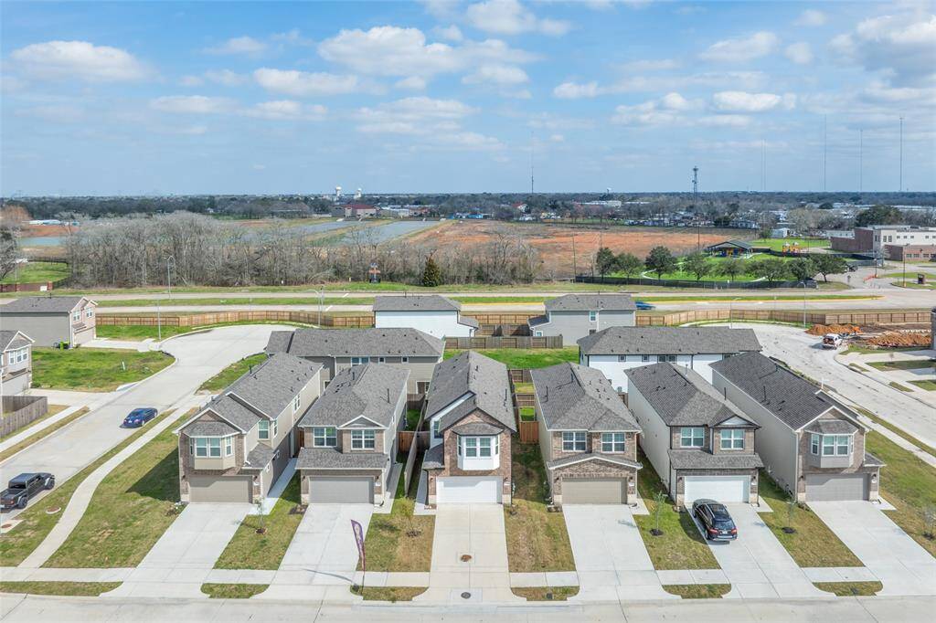 Aerial shot showing the home’s spot in a well-planned, newer community—easy access, uniform builds, and a cohesive neighborhood layout.