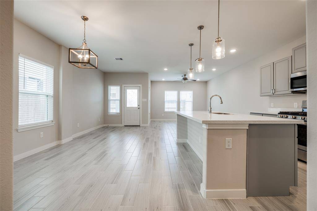Open-concept layout with seamless living and dining flow, and lots of natural light.