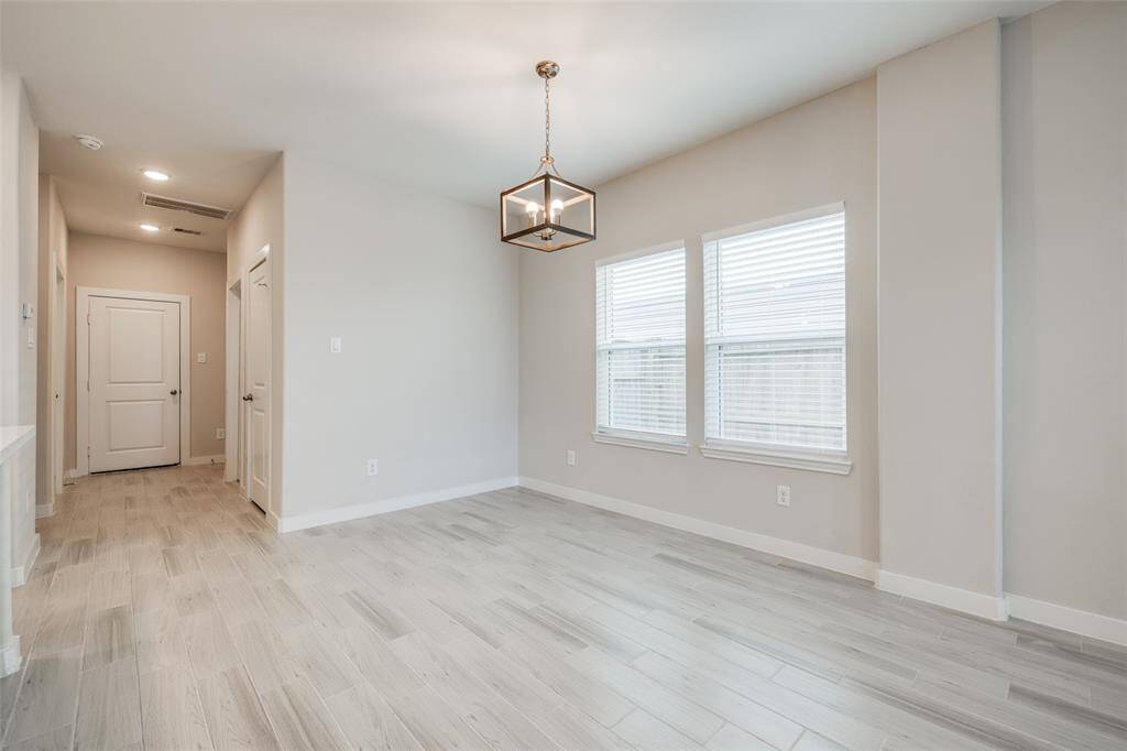 Bright dining area with plenty of natural light and space to gather.
