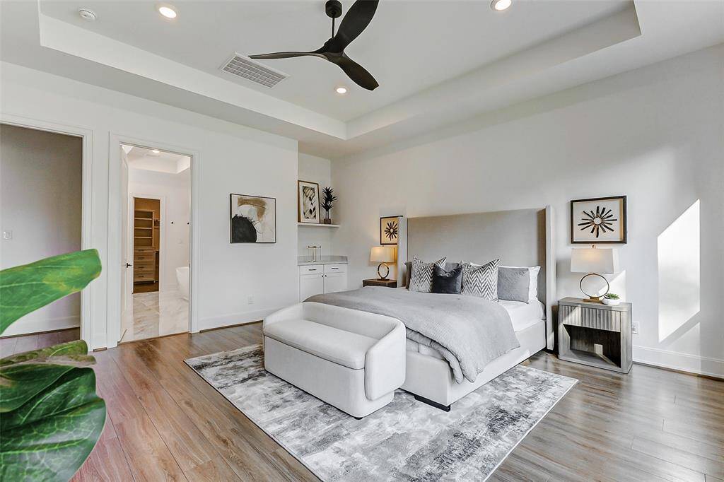Additional touches include designer paint, thick baseboards, and wide-plank vinyl floors that add a layer of timeless elegance to the space. Just beyond, you’ll find the luxurious en suite bathroom awaiting.