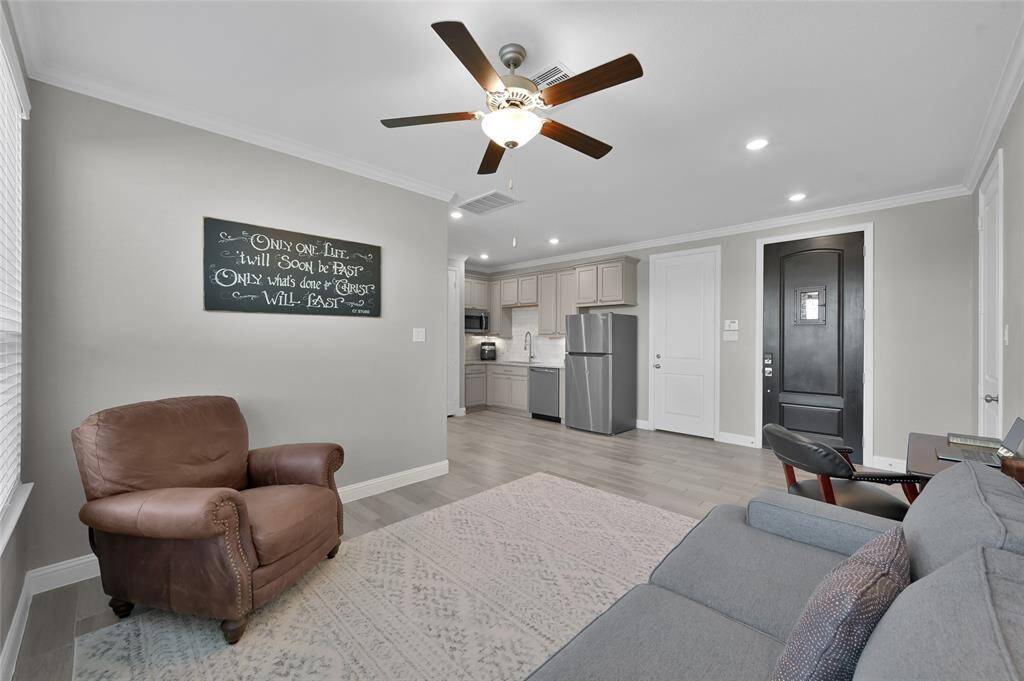 Private quarters (White door to left is the entrance into the home. Black door to the right is the entrance from the front porch.  White door to the far right is the entrance from the single bay garage.)