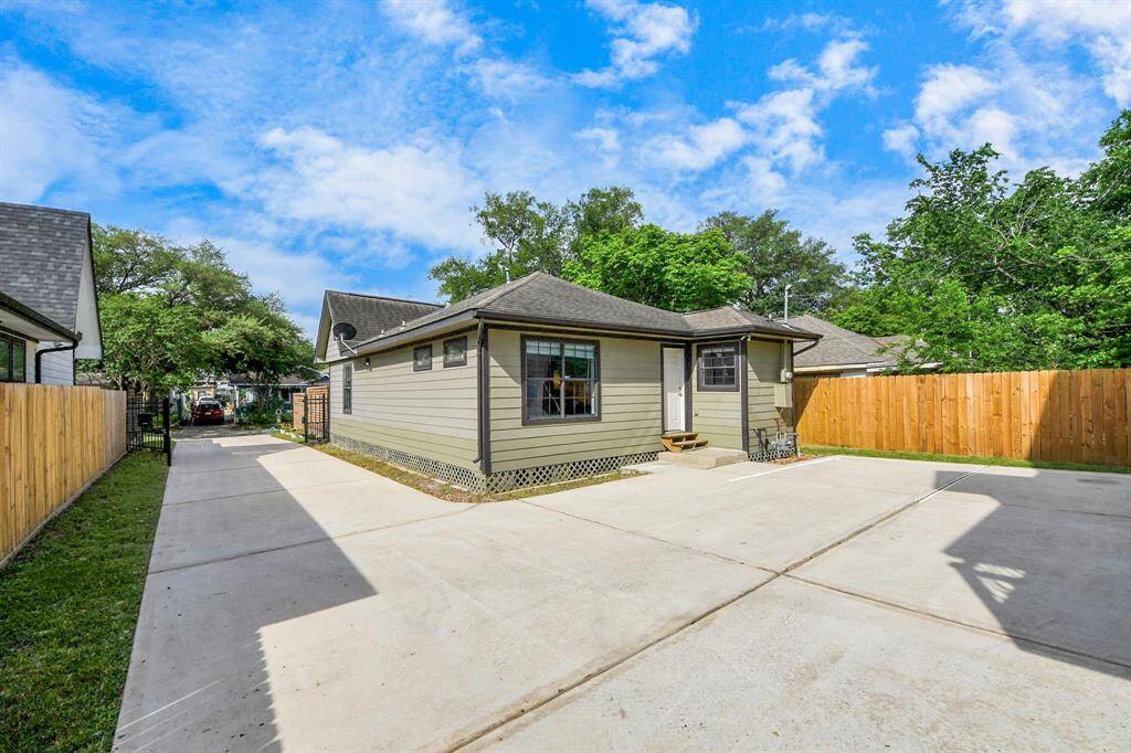 gated extended driveway with spacious parking between the main home and garage apt.