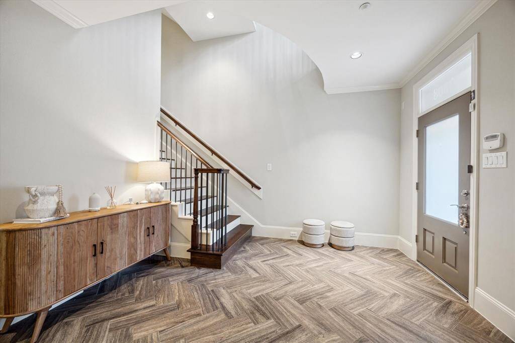 A different view of the super wide foyer as seen from the ground floor bedroom.