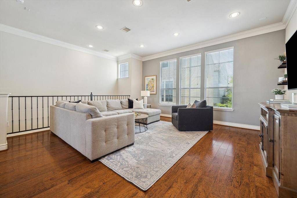 The modern, sleek railing enhances the open feel of the space while adding a touch of style.