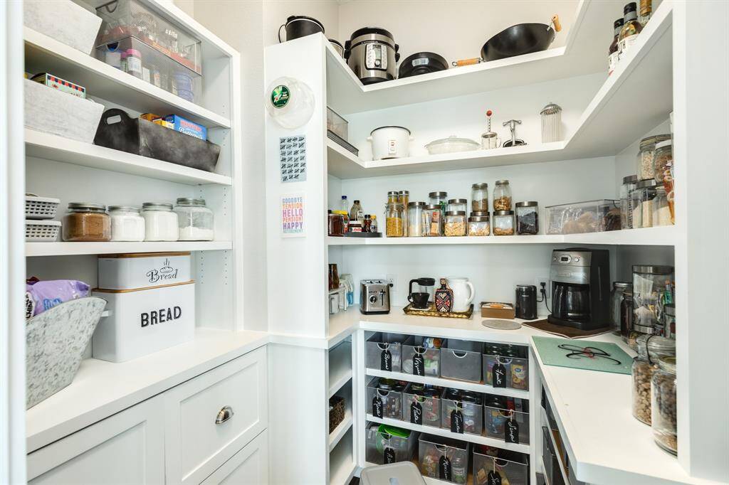 To die for walk-in pantry! Neat and organized.