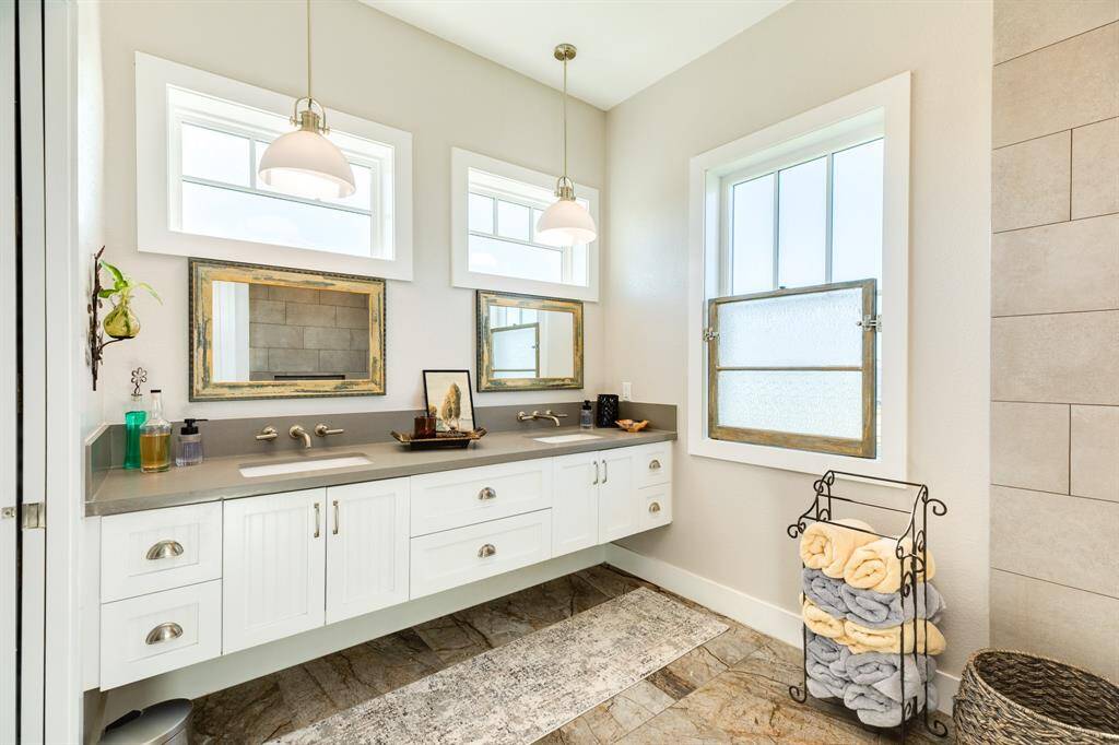 Primary en-suite with dual sinks and a wet shower