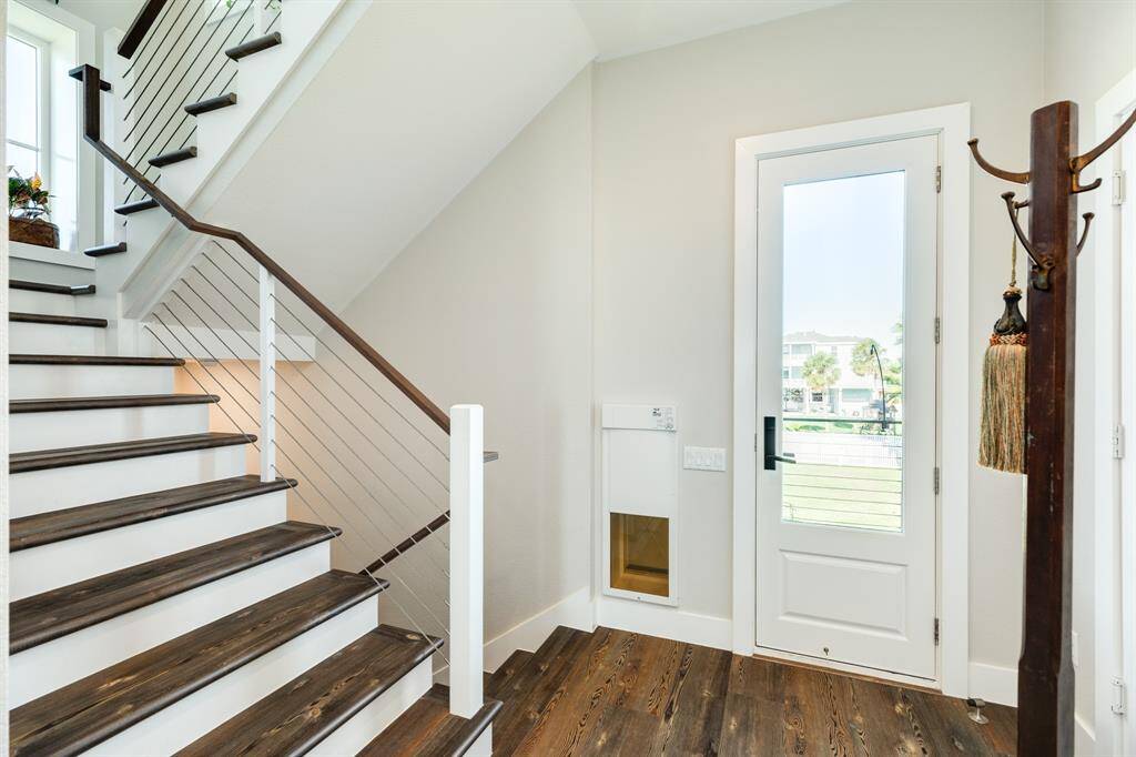 Indoor stairwell leads from the garage to the second living floor.  On the right side is the space for a future elevator