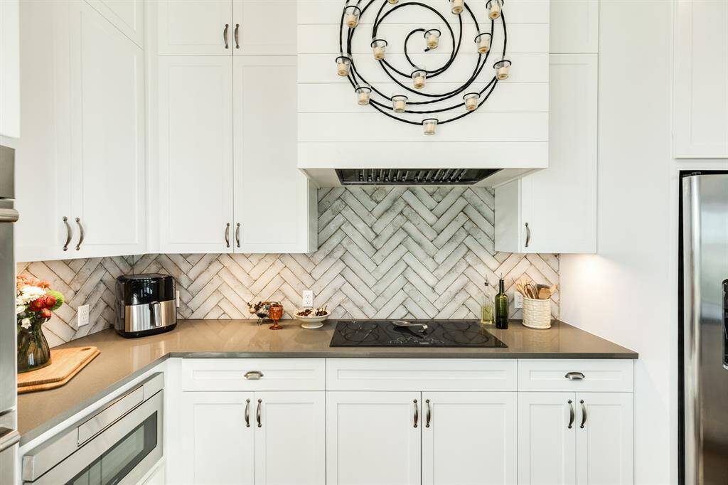Custom herringbone backsplash, under counter lighting.