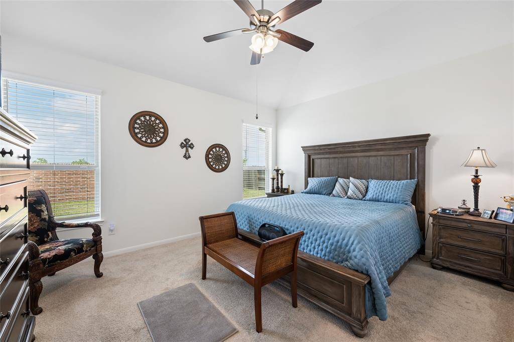 The primary bedroom suite offers ample space for furniture.