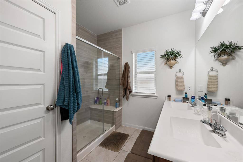 Double sinks and a walk-in shower make getting ready for your day a breeze.
