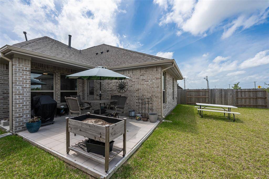 Extended patio area perfect for relaxing and hosting a backyard cookout.
