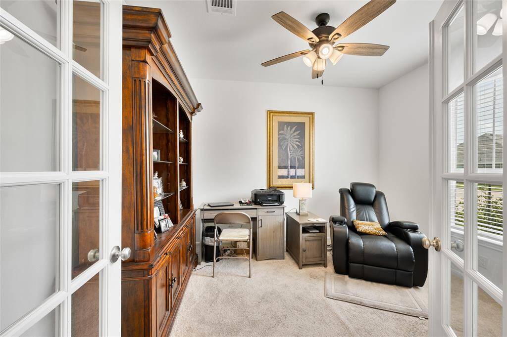 Double glass doors welcome you to the home office. Perfectly positioned at the front of the home to easily welcome clients and guests.