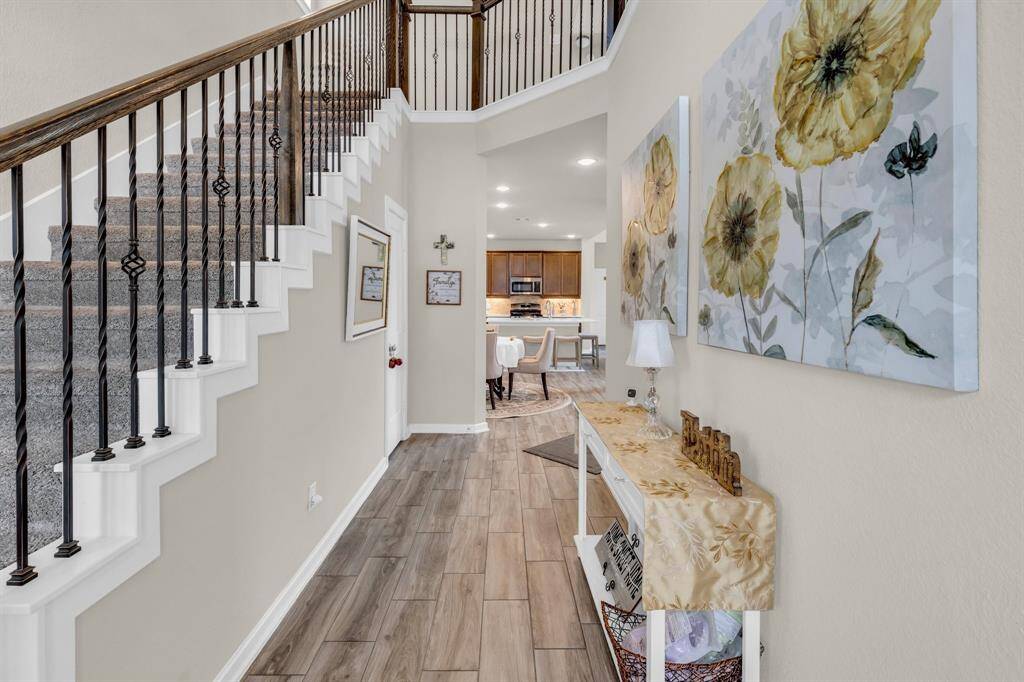 Beautiful entry way leading you to the living room and kitchen.