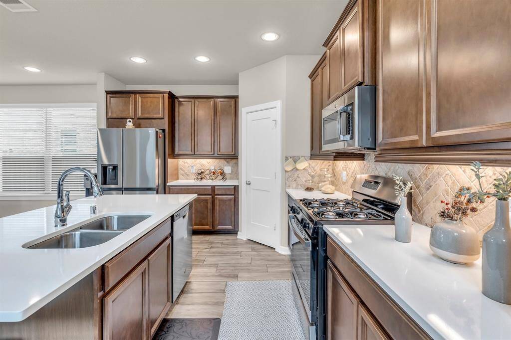 Well designed kitchen has ample counter space for all of your cooking needs and plenty of cabinets!